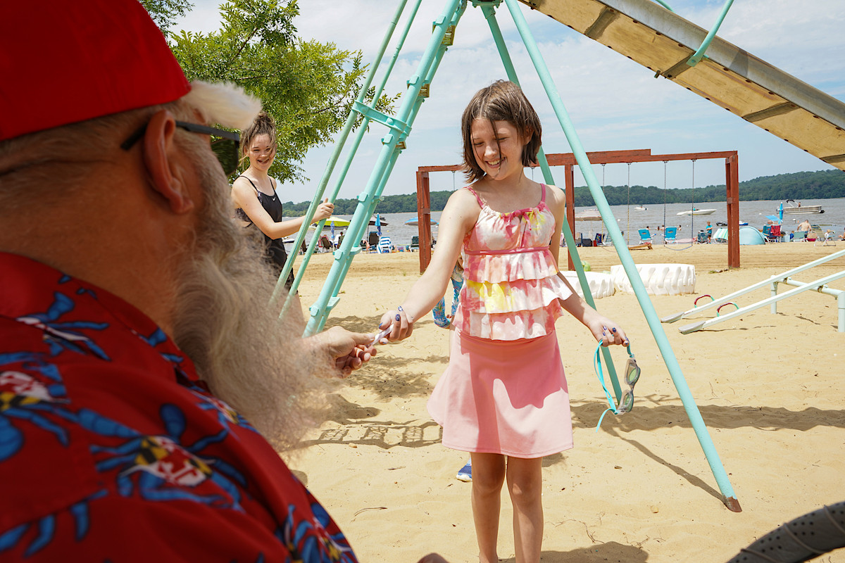 Santa on the beach with girl