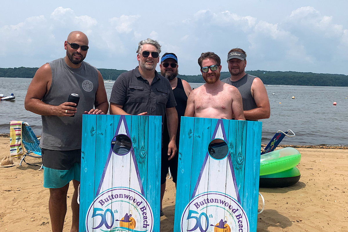 Guys with corn hole game